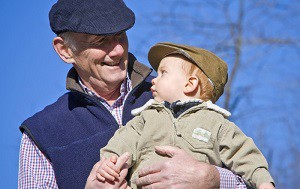 Grandpa holding grandson