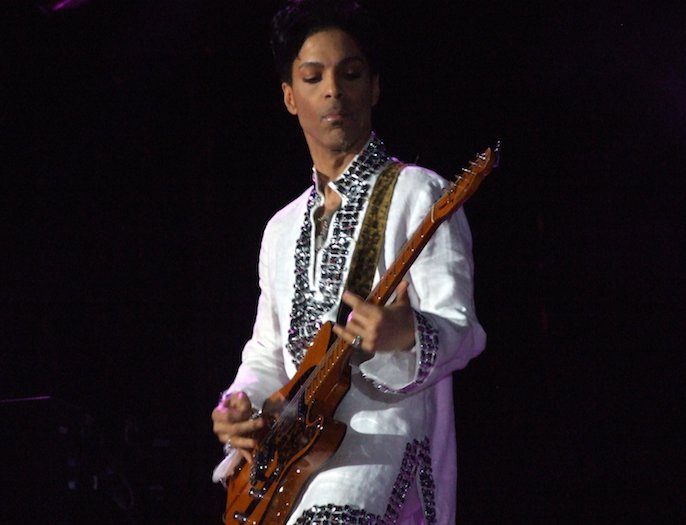 Prince playing guitar