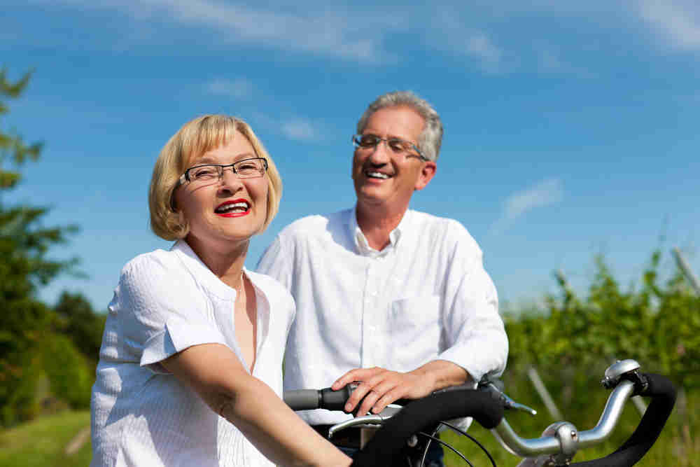 Man and woman riding bikes