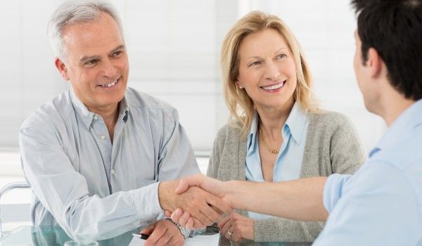 Man and woman signing medical power of attorney