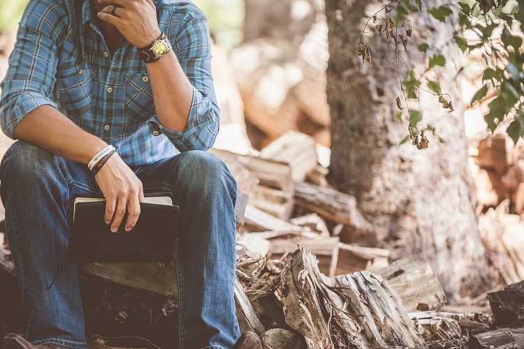 Man Sitting on log